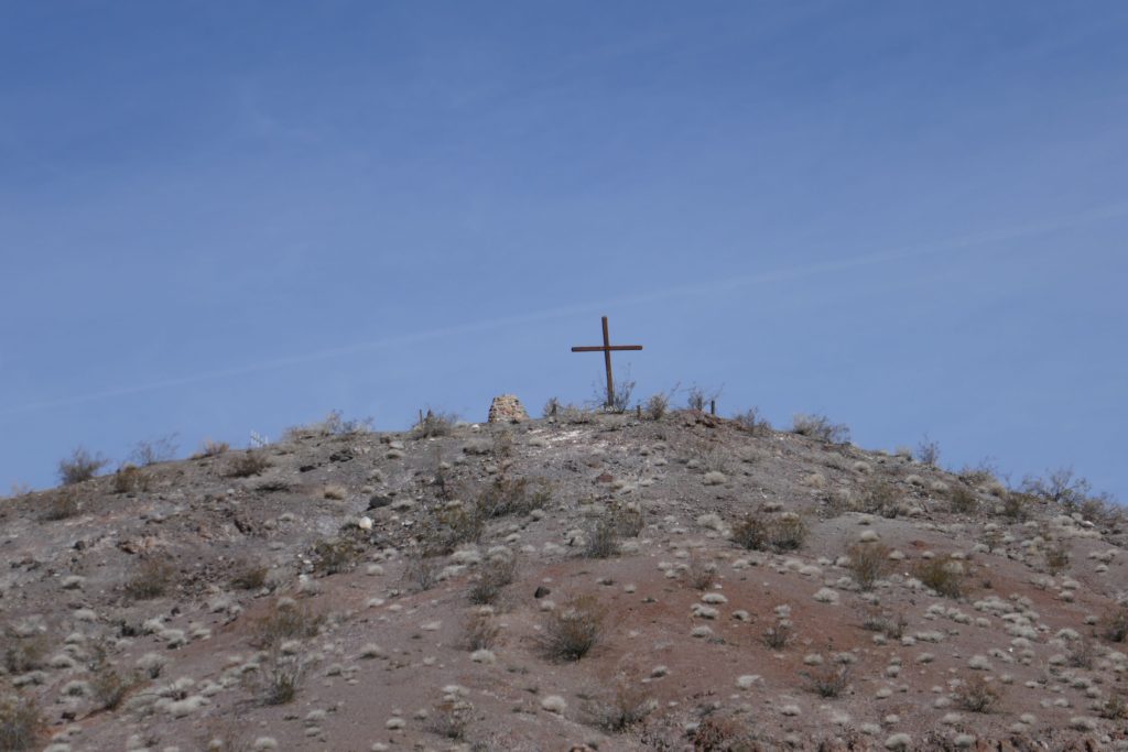 Death Valley Scotty's grave on top of a hill marked by a cross